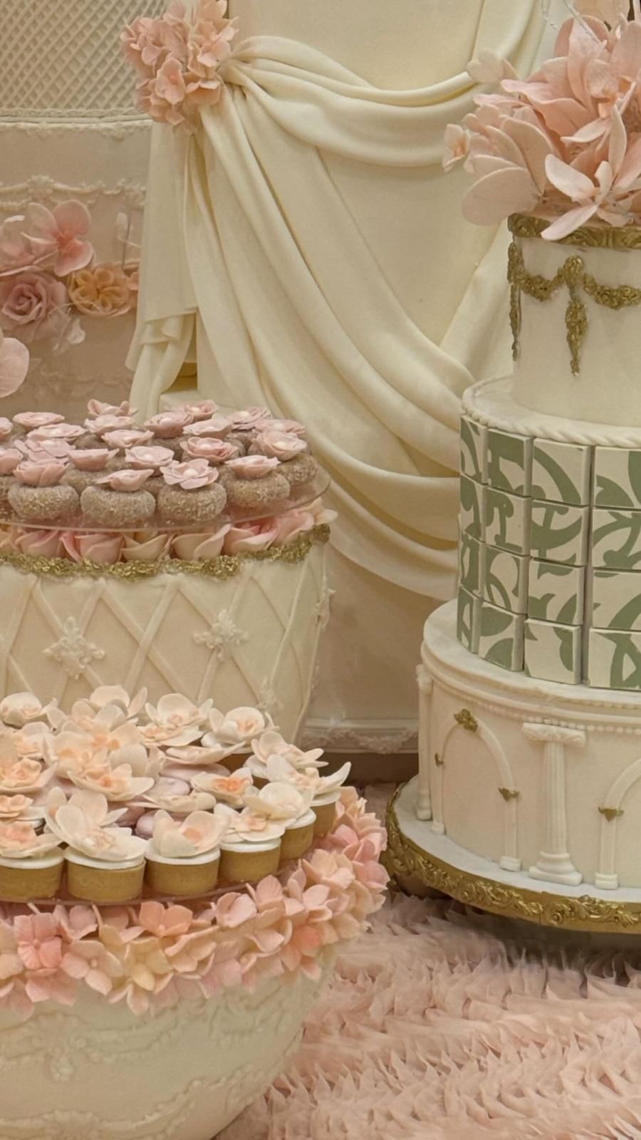 Floral Bites and sweet corner. from Qatar to Riyadh. perfect for events, weddings and engagements in the GCC, Qatar and Saudi Arabia. Includes tarts and coconut bites with fondant decoration